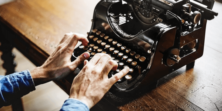 A man working on a typewriter.