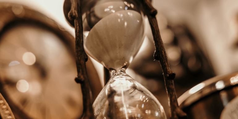 An hourglass with a wooden frame.